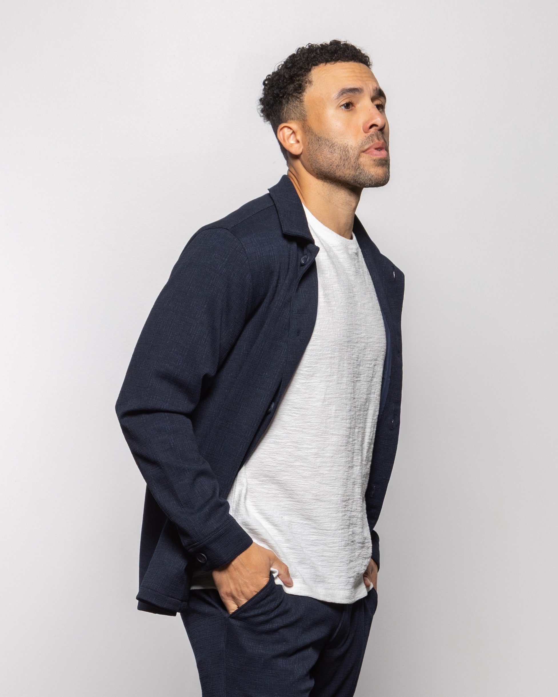 Milan indigo night jacket worn open over a T-shirt, button-front style
