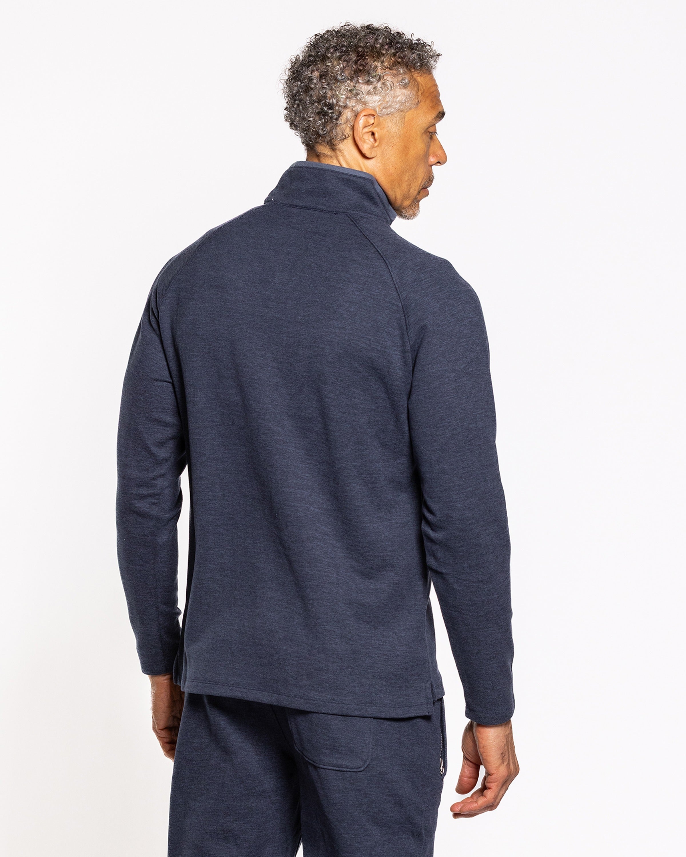 Men's quarter-zip pullover back view in dark indigo, long sleeves and zip collar.