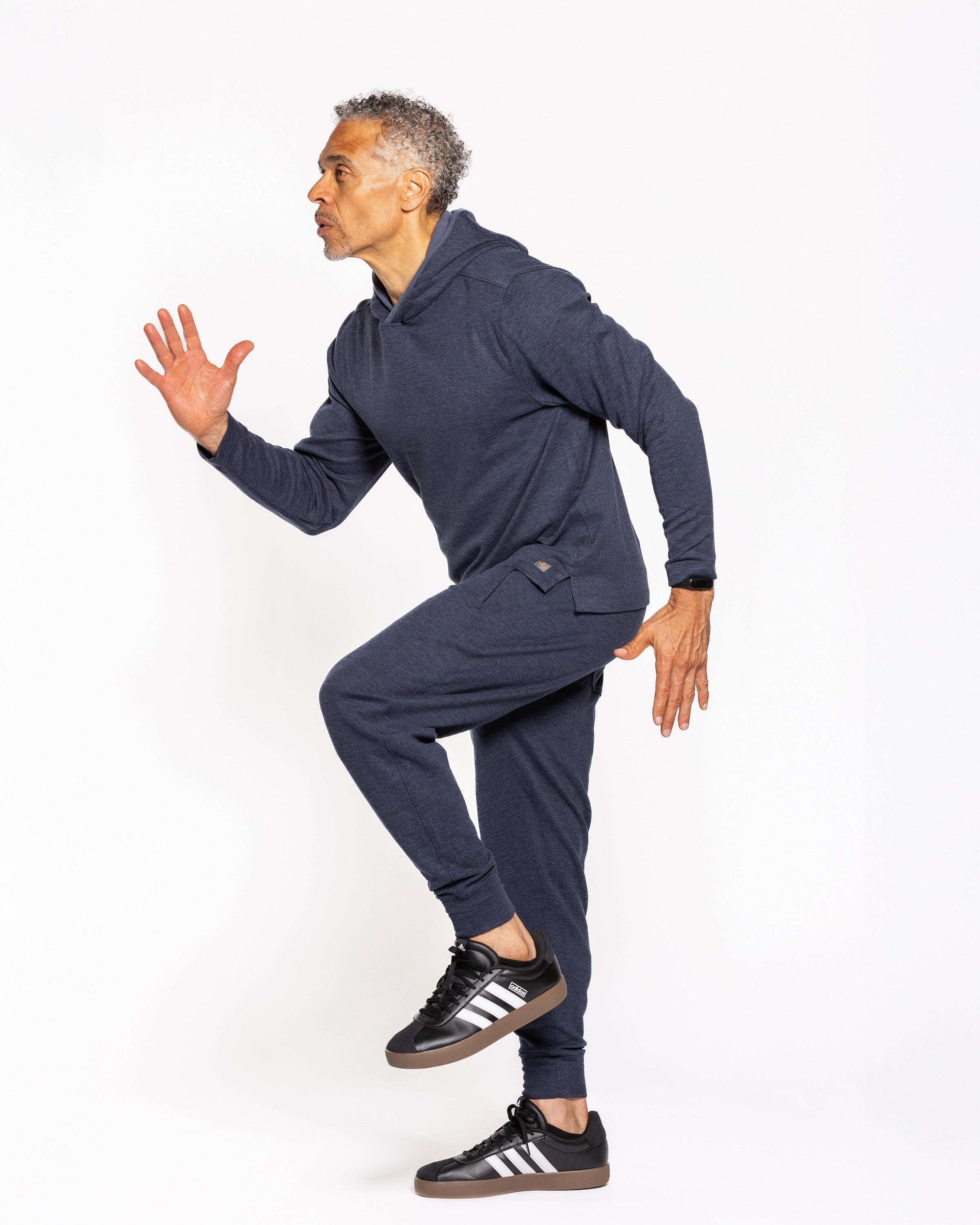 Navy jogger pants in side view with drawstring and cuffed hems