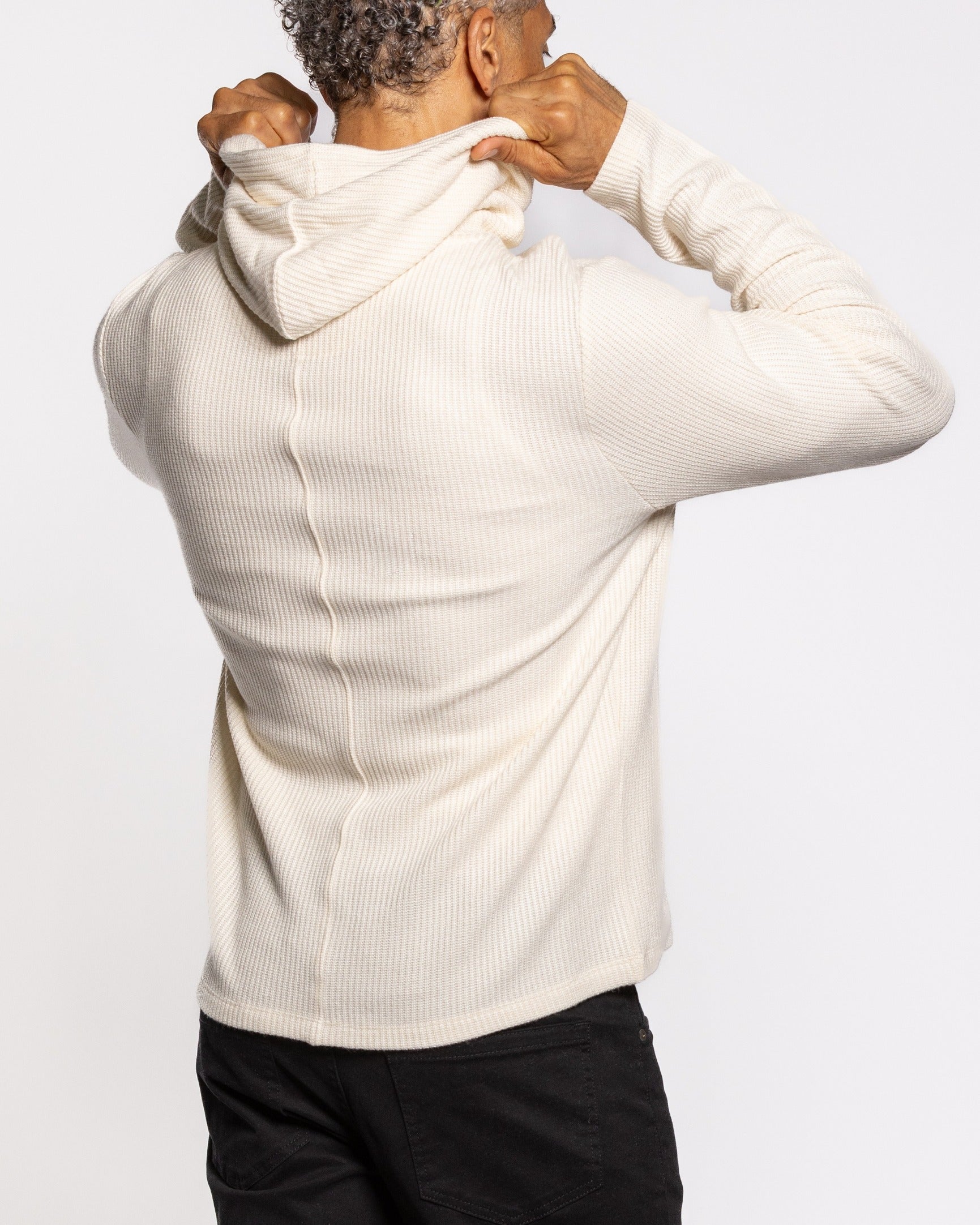Off-white ribbed hoodie, hooded back view with long sleeves and cuffed hem