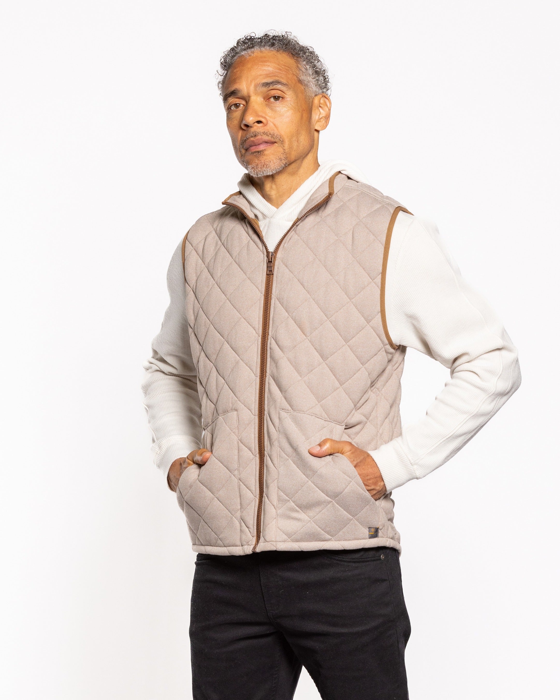 Light gray quilted full-zip vest with stand collar and diamond stitching