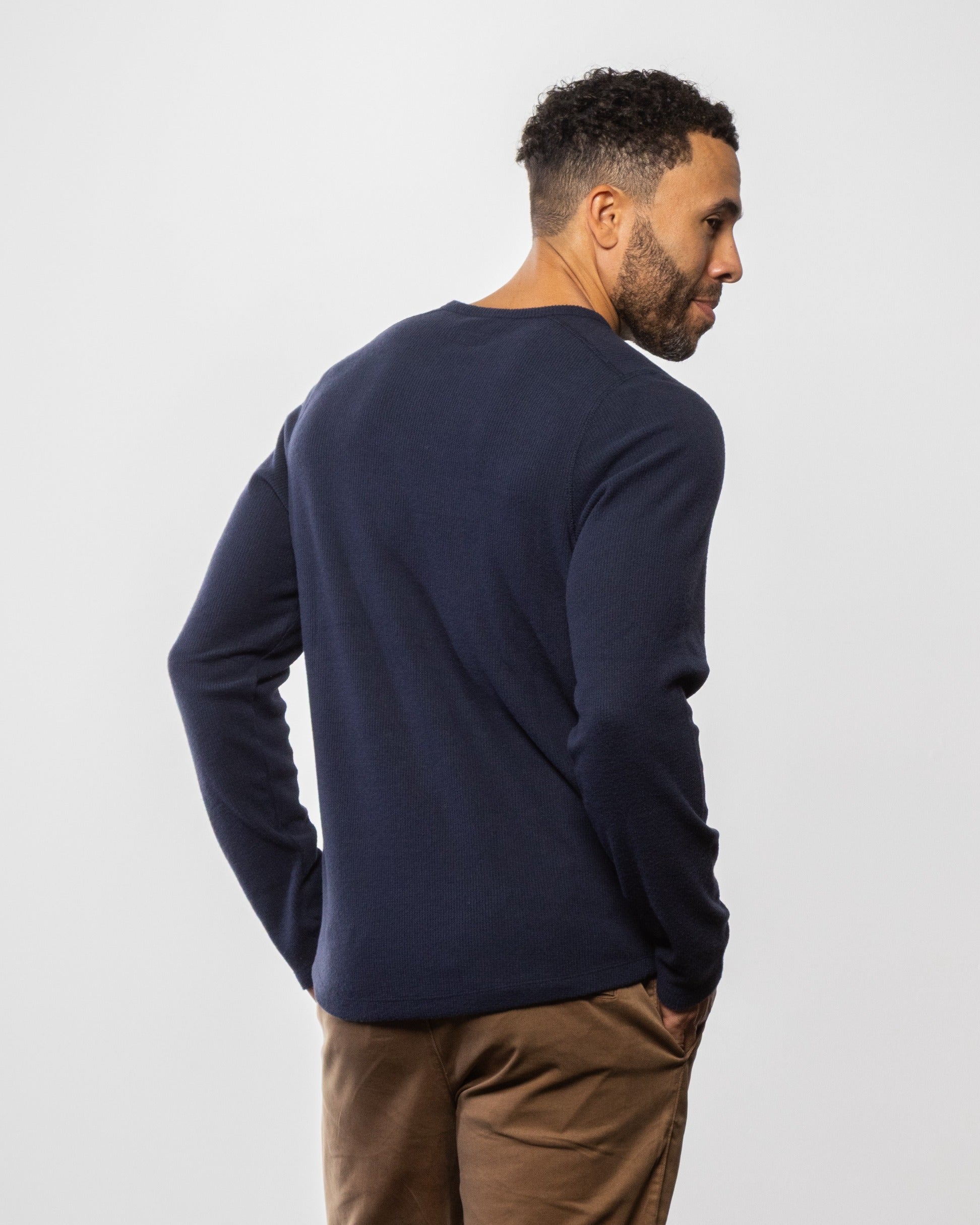 Men's indigo crewneck sweatshirt, back view with long sleeves