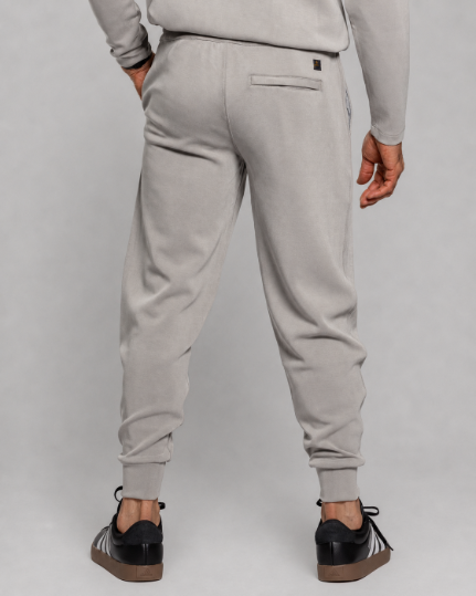 Gray tall jogger pants back view with zip pocket detail and tapered ankle cuffs
