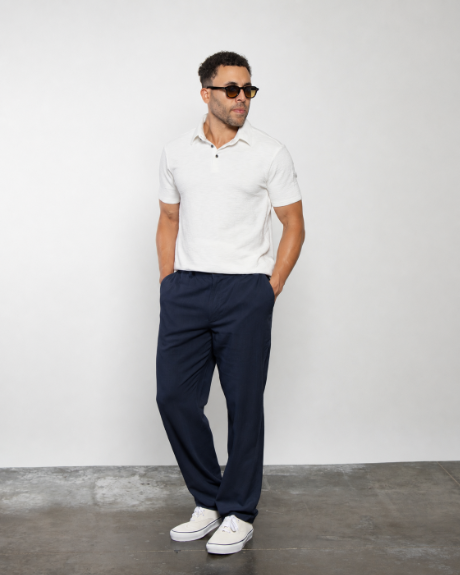 Dark navy trousers with relaxed straight legs and belt loops
